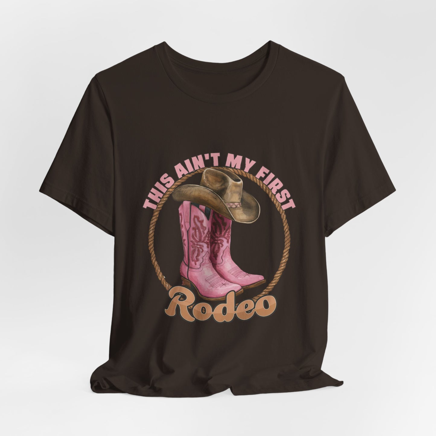 Rodeo Tee — "This Ain't My First Rodeo" Pink Boots & Cowboy Hat Graphic