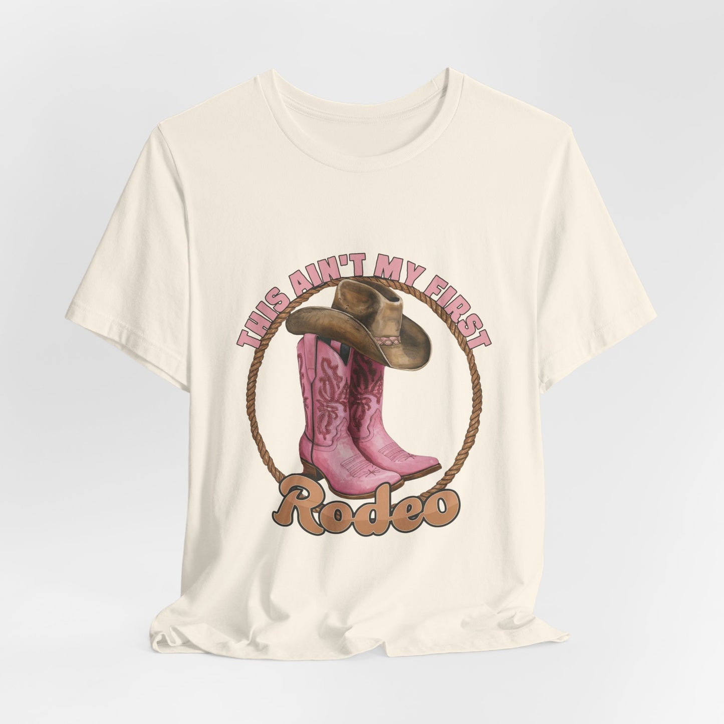 Rodeo Tee — "This Ain't My First Rodeo" Pink Boots & Cowboy Hat Graphic