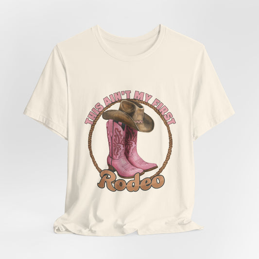 Rodeo Tee — "This Ain't My First Rodeo" Pink Boots & Cowboy Hat Graphic