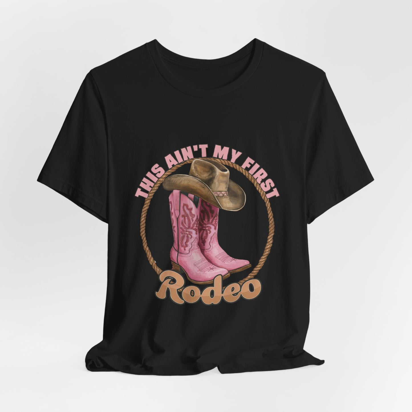 Rodeo Tee — "This Ain't My First Rodeo" Pink Boots & Cowboy Hat Graphic