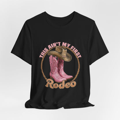 Rodeo Tee — "This Ain't My First Rodeo" Pink Boots & Cowboy Hat Graphic