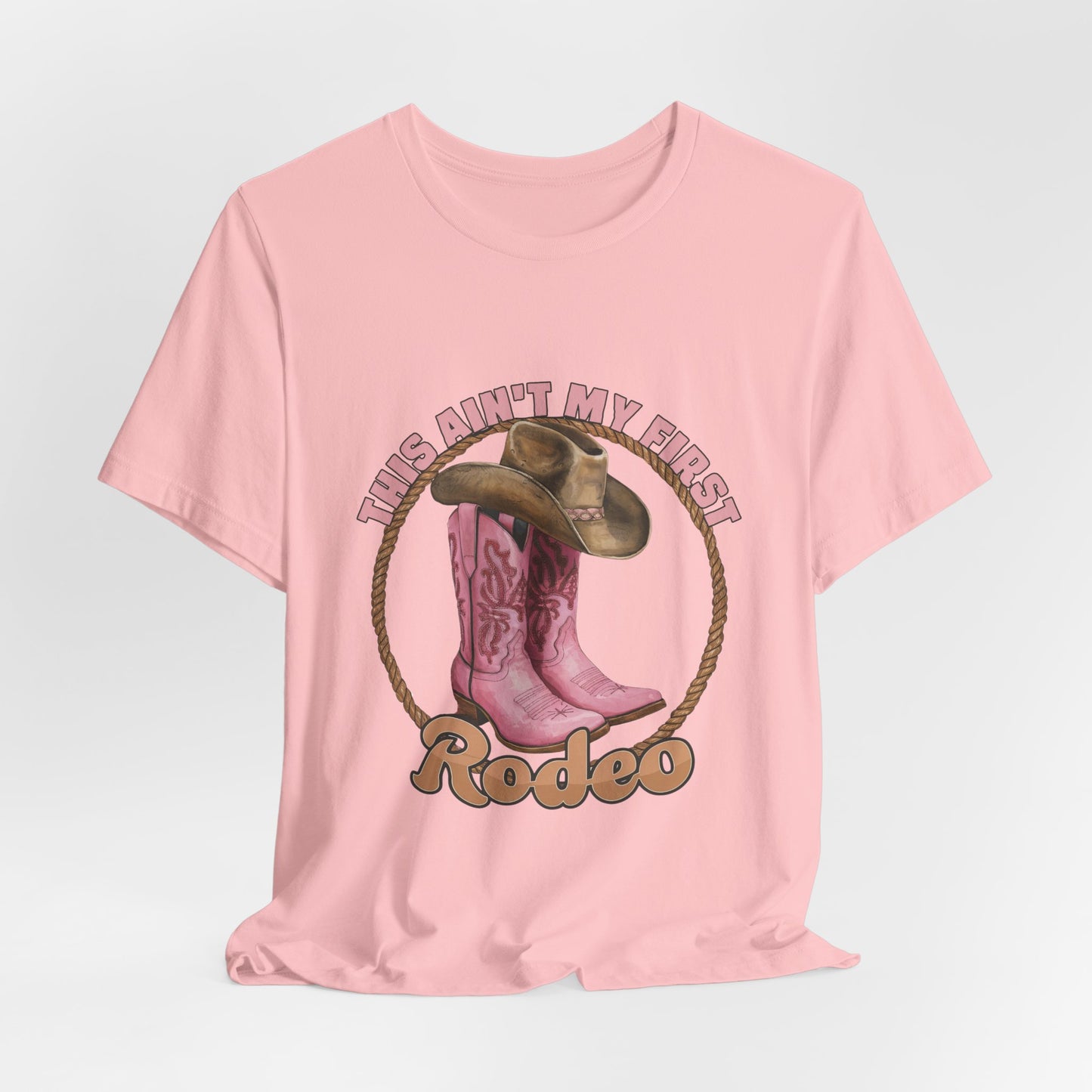 Rodeo Tee — "This Ain't My First Rodeo" Pink Boots & Cowboy Hat Graphic