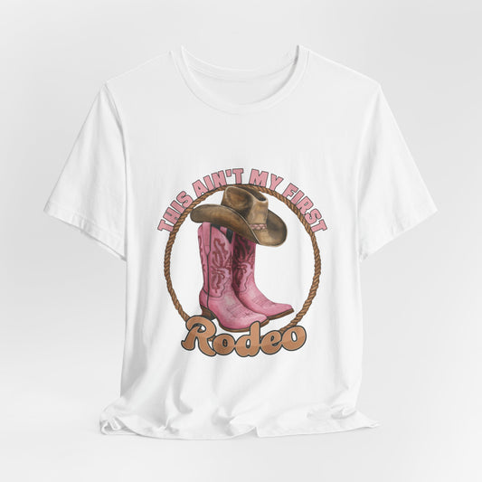 Rodeo Tee — "This Ain't My First Rodeo" Pink Boots & Cowboy Hat Graphic